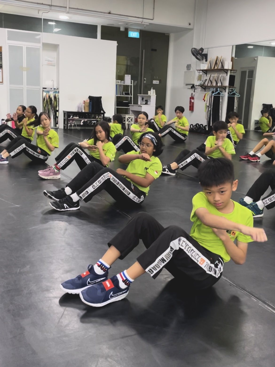 Young student training with instructor
